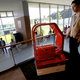 A porter robot escorts a human to a room.